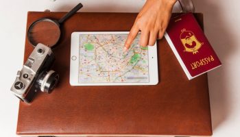 top-view-suitcase-with-camera-passport_23-2147653036